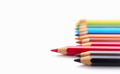 Red pencil standing out from others,One sharpened pencil standing out from the other pencil.