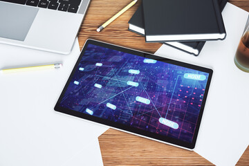Top view of modern digital tablet monitor with abstract programming language hologram, artificial intelligence and machine learning concept. 3D Rendering