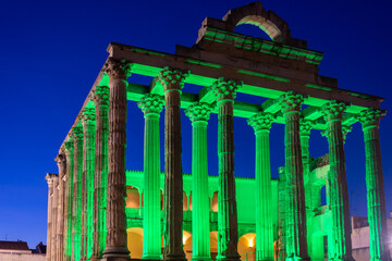 Night view of the Temple of Diana in Merida (Spain), a World Heritage city, illuminated by a green...