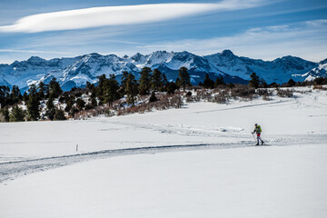 woman skiing alone in mountains
