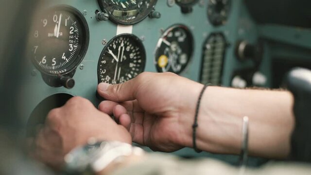 the pilot in the cockpit prepares for flight and checks the aerometric instruments altimeter artificial horizon heading indicator airspeed indicator variometer turn and slip indicator
