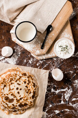 Fototapeta na wymiar pancakes with sour cream on the table. Flat lay top-down