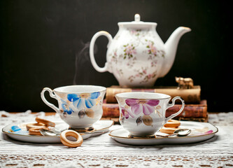 Obraz na płótnie Canvas cup of tea and teapot on table