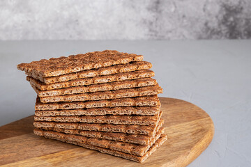 Rye breads without sugar for a healthy diet on a wooden board.