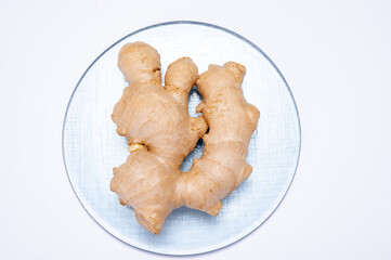 Fresh ginger rhizome root used in traditional medicines and for flavoring meals isolated on white