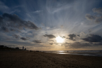 Winter walking on wide sandy beach of North sea near Zandvoort in Netherlands