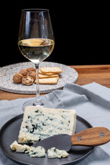 Cheese and wine pairing, french soft blue roquefort cheese and sweet white sauternes wine from Bordeaux, France