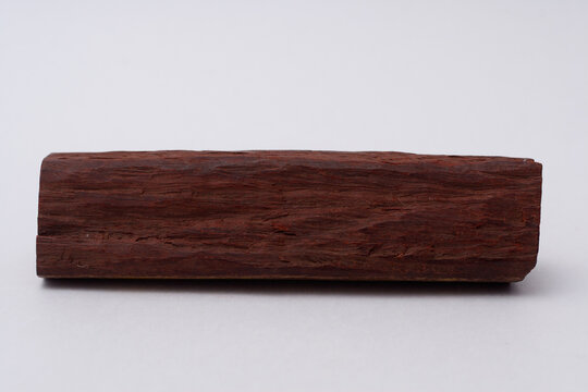 One sandalwood log on white background
