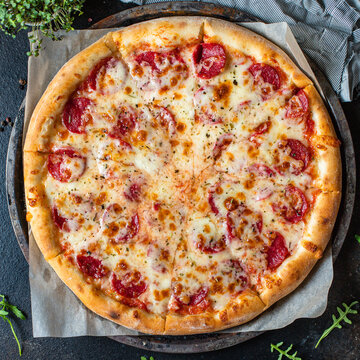 pizza pepperoni with meat sausage and double cheese fast food Takeaway ready to eat portion on the table for healthy meal snack outdoor top view copy space for text food background rustic image