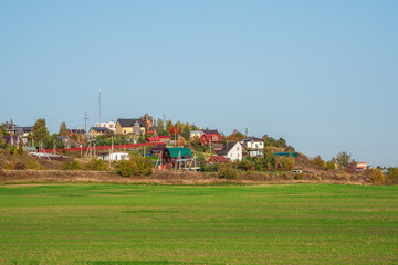 Modern cottage village in a green field.
