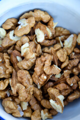 Walnuts harvest on vintage metal background. Walnut kernels from village garden. Organic autumn nuts harvest.