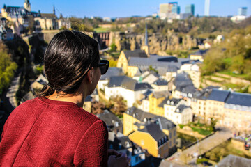 Fototapeta premium latin girl enjoying the view at a luxembourg lookout point 