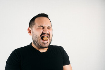 a man tries to crack a nut with his teeth. the concept of a complex problem or strong teeth