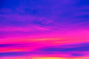 Obraz premium Vivid saturated beautiful sunset sky in pink, purple and blue colors. Sunset background