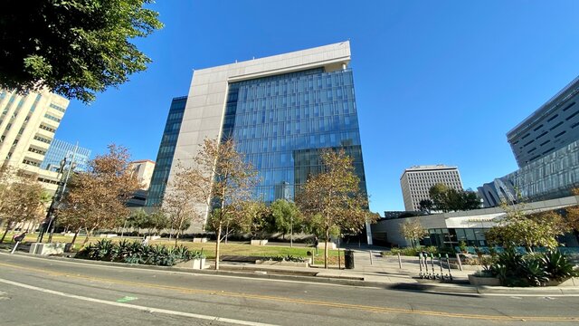 LOS ANGELES, CA, DEC 2020: wide angle view of small, inner-city park and nearby buildings at rear of Los Angeles Police Department Headquarters in Downtown, daytime