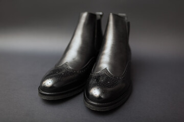 Shoes, chelsea leather boots for men. Male winter, autumn or spring fashion. Footwear on black background. Sale