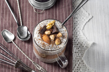 Chia pudding with cocoa, chocolate and nuts in almond milk