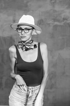 Fashion style portrait of woman wearing hat and sunglasses. black and white 