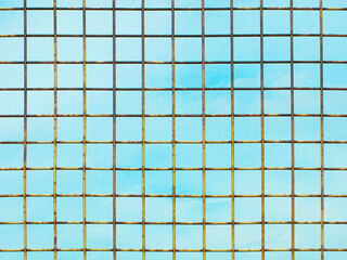 Metal lattice against light blue sky, illustration