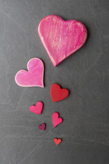 Various Valentine’s hearts on stone background