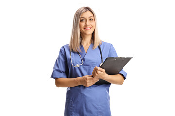 Female health care worker in a blue uniform holding a clipboard