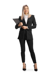 Fototapeta premium Young businesswoman holding a clipboard and smiling