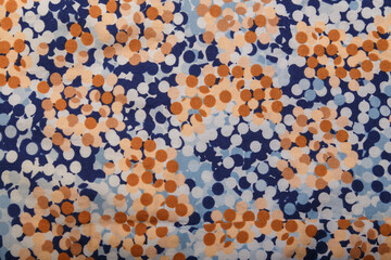 Blue, beige and brown polka dot shirt fabric texture. Cloth material surface
