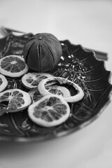 Natural Christmas decorations are laid out on a tray