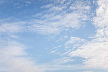 Naklejka na ściany i meble Blue sky with beautiful white clouds at sunny day