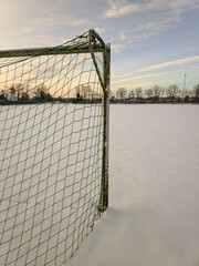 Fussballplatz mit Schnee und Fussballtor  © vsnyder