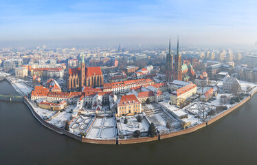 Winter season in Wroclaw, Poland. Panoramic aerial cityscape of Ostrow Tumski (Cathedral Island) on sunny and frosty day