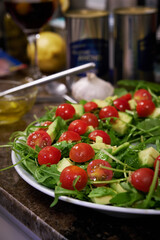 arugula salad and cherry tomatoes and avocado