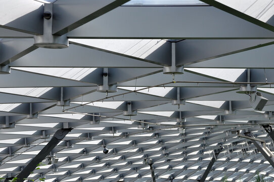 Modern pavilion roof made of glass and metal. Construction.