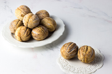 Nuts with condensed milk on a white background