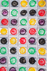 Colorful condoms background.