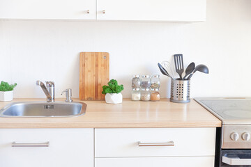 Scandinavian classic minimalistic kitchen with white and wooden details. Modern white kitchen clean contemporary style interior design.