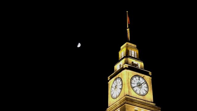 Time lapse view The Bund or Waitan Shaghai Bank building clock tower located at a waterfront area and a protected historical district in central in the city center footage during evening 4k quality