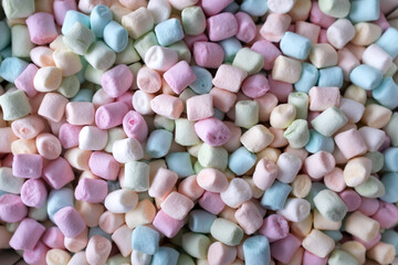 Colored miniature marshmallows. Top view. Macro photography.