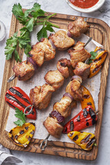 Grilled pork kebab with red and yellow pepper