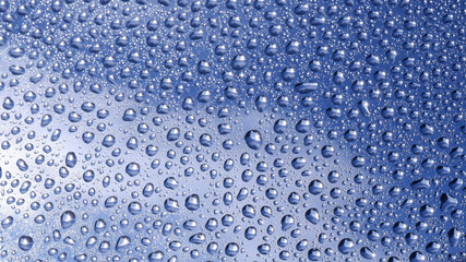 Water droplets on the glass reflect light and flicker