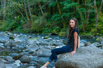 Young Woman Poses Along the Banks of a River