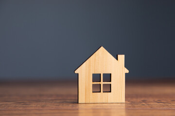 wooden house model on table