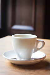 a cup of espresso on a table in a bar, cafe, restaurant