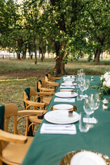 empty wedding table and chairs in a garden