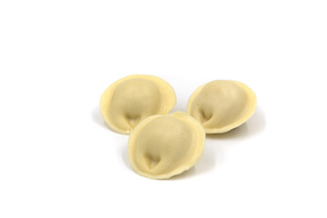 Three dumplings on a white background. Russian pelmeni.