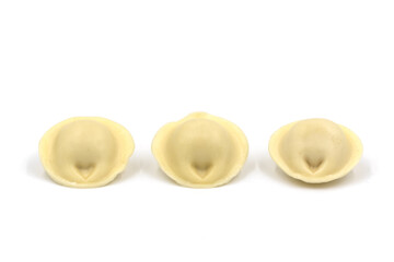Three dumplings on a white background. Russian pelmeni.