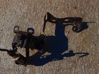 Brake distributor isolated rusty on a grey background