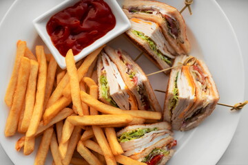 Chicken Club Sandwich With Fried Potato. Grilled Clubhouse Toast With Turkey Ham On White Plate Top...