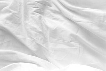 White Bedding Sheet Texture Close-up. Cotton Sheet Creased Drapery Fold Structure On Bed. Unmade Textile Background Wrinkle Blanket.