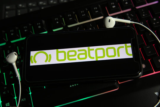 Viersen, Germany - January 9. 2021: Closeup of smartphone screen with logo lettering online electronic dance music streaming download service beatport on computer keyboard
